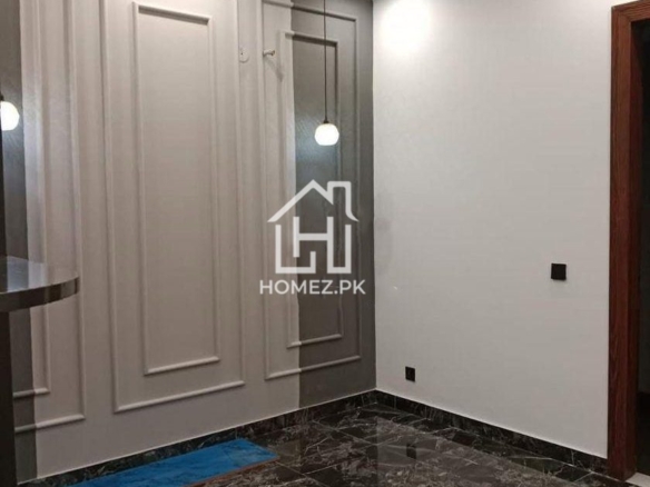 Presenting a premium 1 Kanal luxury house for sale in DHA Phase 6, Lahore, priced at PKR 15.5 Crore. The house features spacious bedrooms with elegant attached bathrooms.