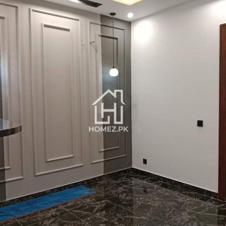 Presenting a premium 1 Kanal luxury house for sale in DHA Phase 6, Lahore, priced at PKR 15.5 Crore. The house features spacious bedrooms with elegant attached bathrooms.