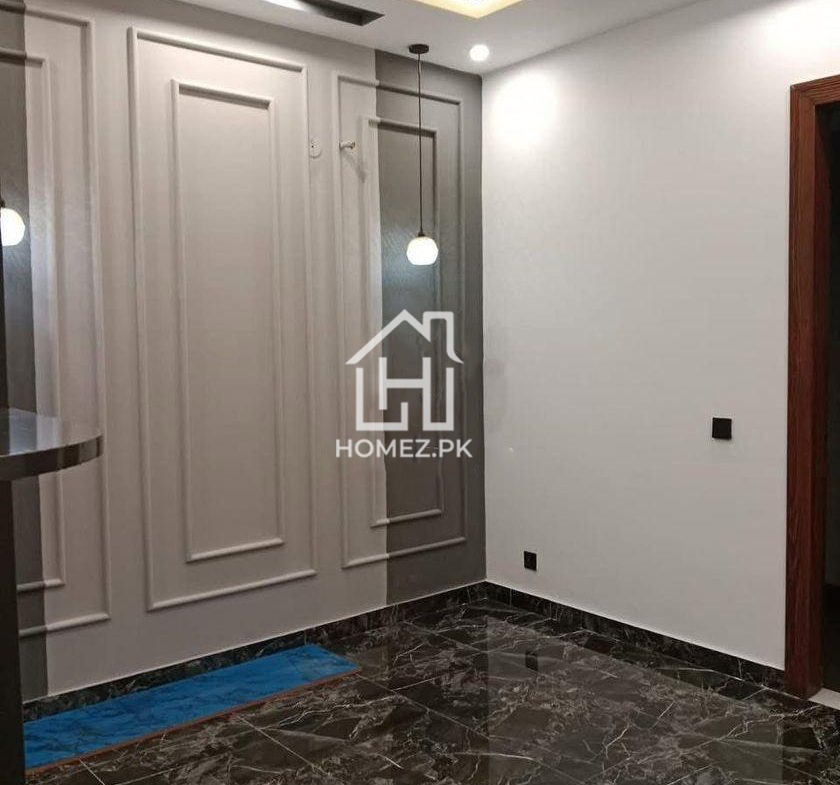 Presenting a premium 1 Kanal luxury house for sale in DHA Phase 6, Lahore, priced at PKR 15.5 Crore. The house features spacious bedrooms with elegant attached bathrooms.