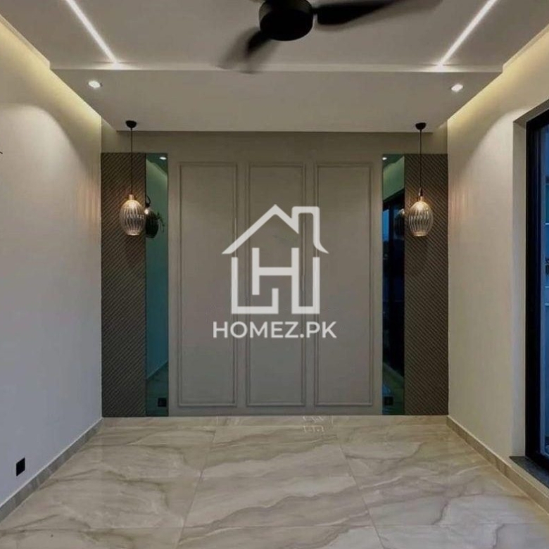 Experience luxury living in this beautifully designed 1 Kanal house located in the prestigious DHA Phase 6, Lahore.